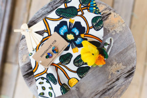 Bridesmaids corsages, cloth fans, and earrings